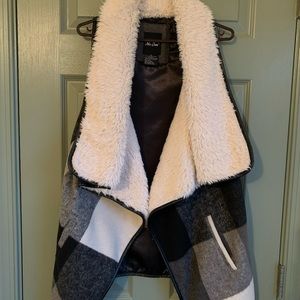 Plaid and fur vest